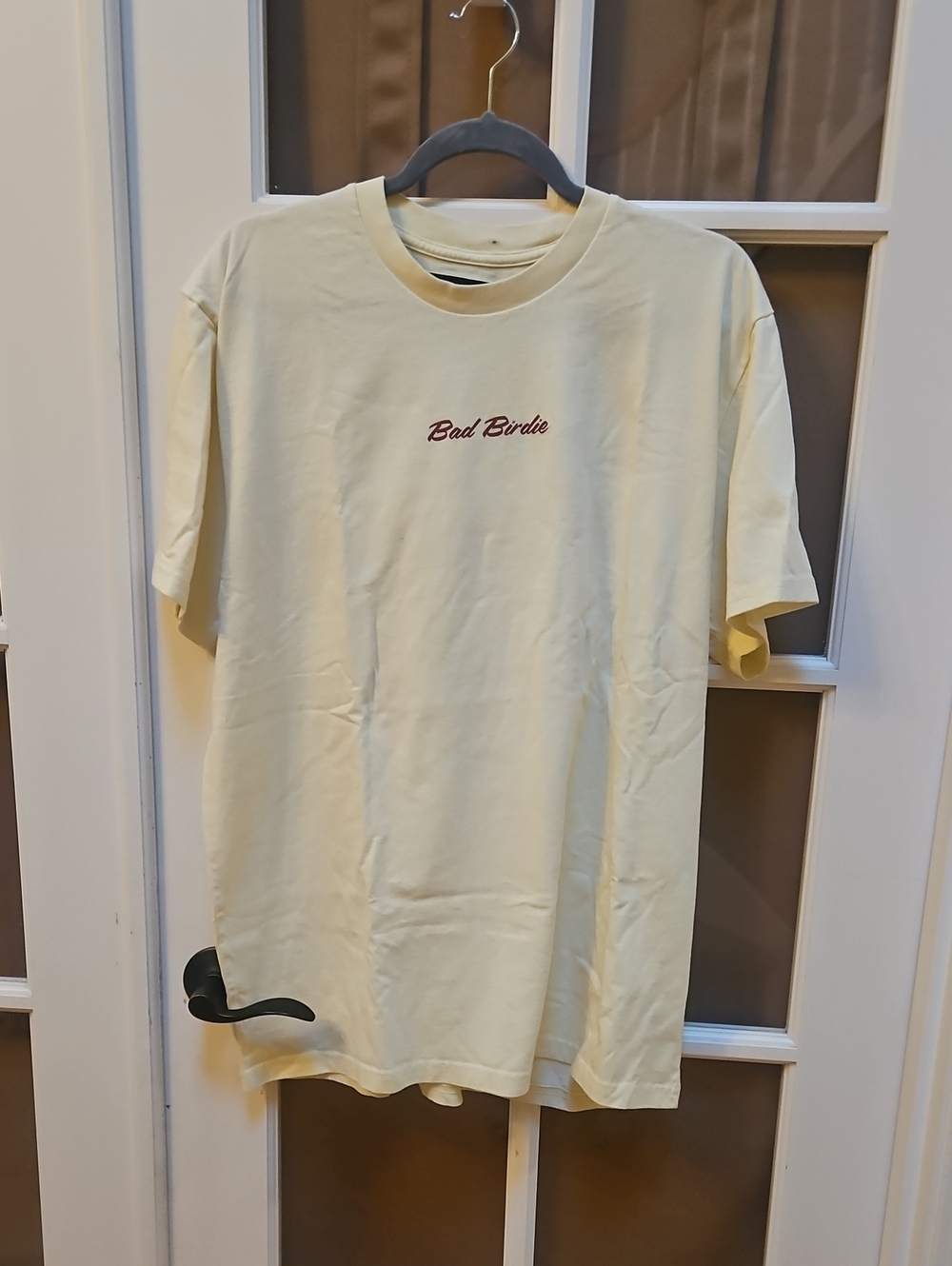 Bad Birdie Pale Yellow Short Sleeve Crewneck Tee with Red Script